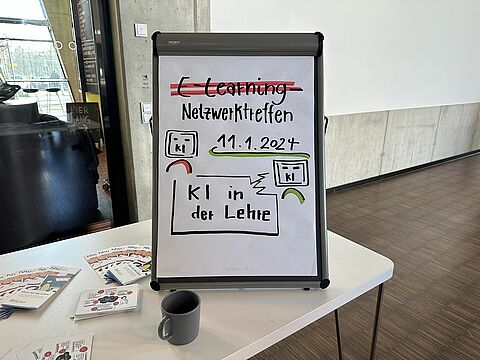Flipchart mit der Aufschrift E-learning Netzwerktreffen, 11.1.2024, KI in der Lehre